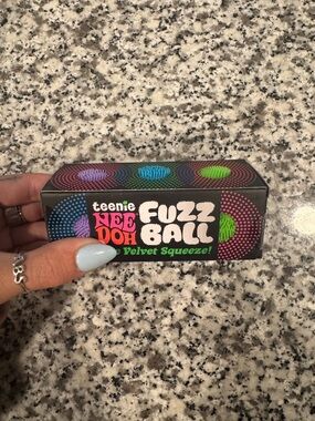 Teenie NeeDoh Fuzz Ball 3 Pack. Purple, Blue, and Green.